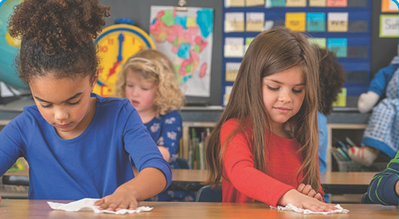 two kids working at a desk